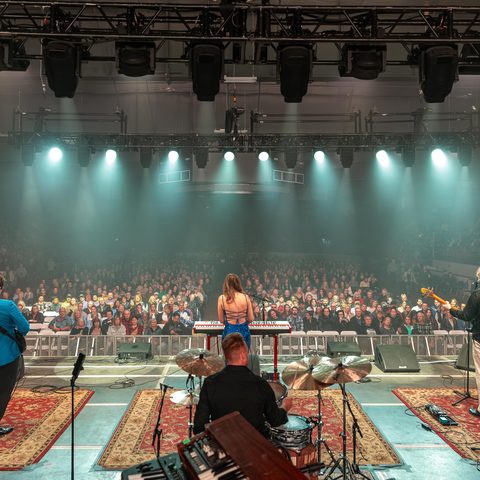 Awake & Dreaming from behind the band, facing the sold-out Owen Sound arena crowd opening for Blue Rodeo 2026