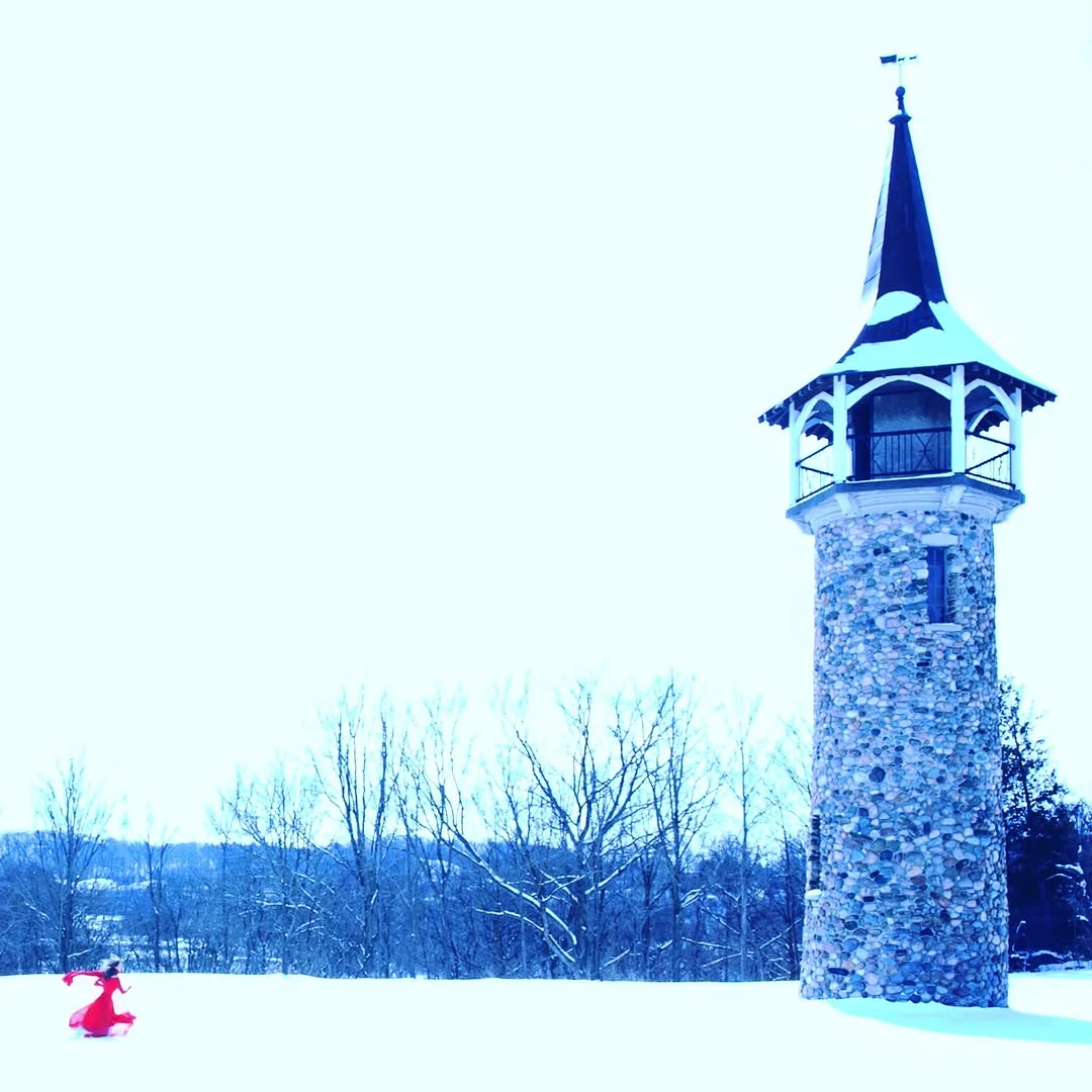 Awake & Dreaming's Sasha Kristoff running towards Waterloo's Pioneer Tower for Something to Believe In Music Video