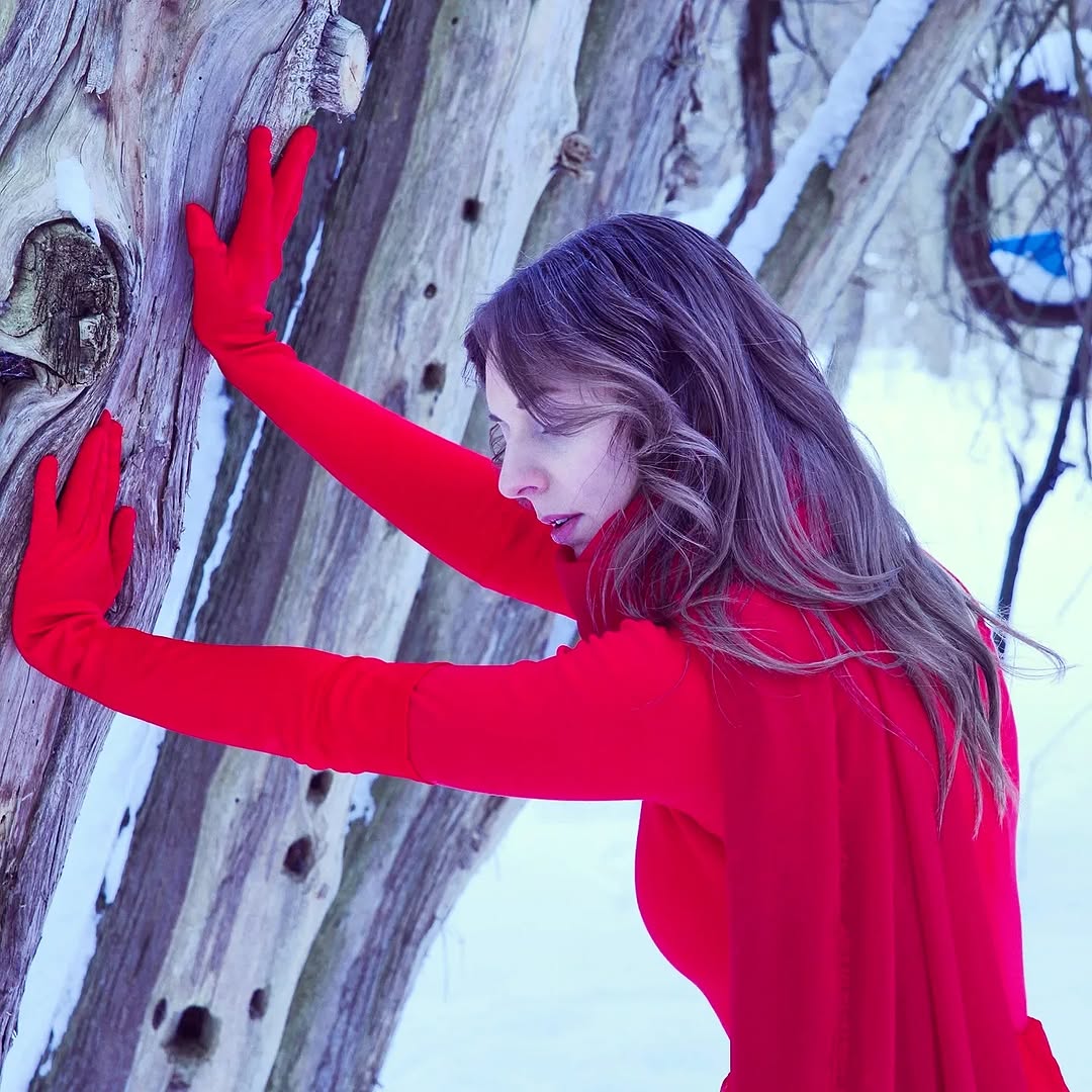 Awake & Dreaming's Sasha Kristoff exhausted posing for a photo in a forest for Something to Believe In Music Video