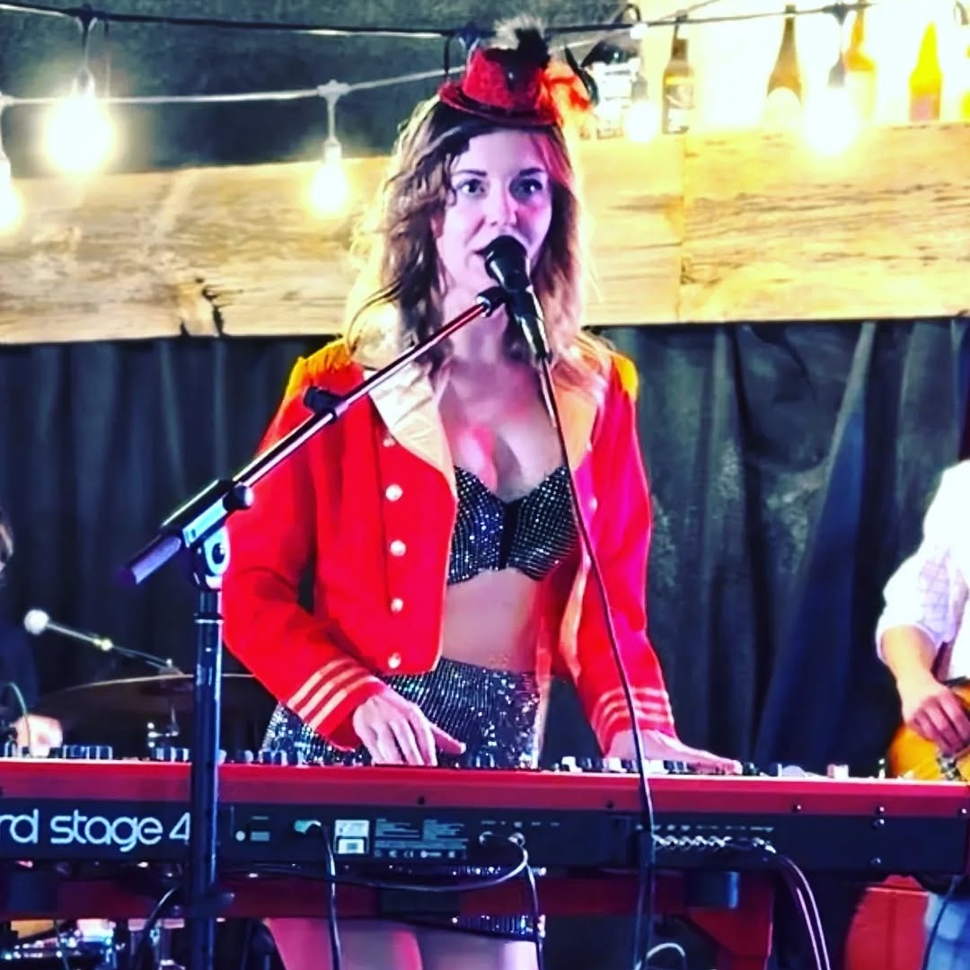 Awake & Dreaming's Sasha Kristoff performing at Clifford Brewing Hamilton for Halloween as Ring Master