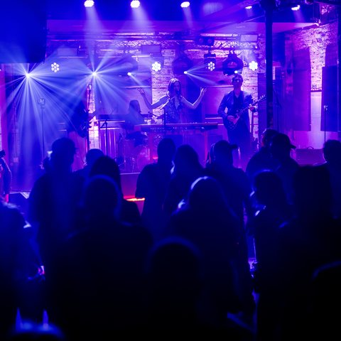 Awake & Dreaming on stage at Rum Runners London Ontario 2026, seen over the crowd