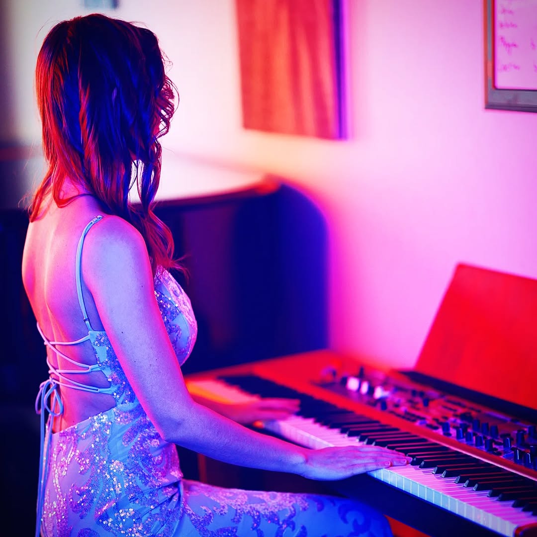 Sasha Kristoff posing with iconic keyboard