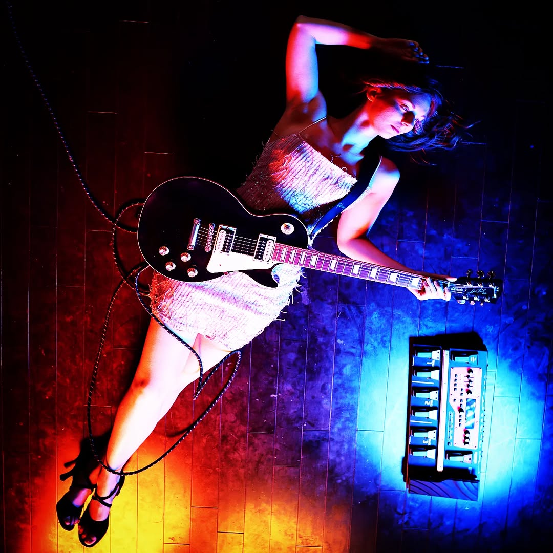 Sasha Kristoff of Awake and Dreaming performing live in sequined gown