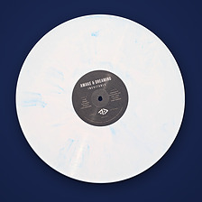 Inevitable on white and blue marbled vinyl, black centre label with the Side A and Side B tracklist